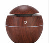 MistAura Aroma Diffuser – Compact USB humidifier with wooden design for home and office use.