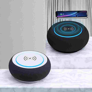 BoomBass Bluetooth Speaker showcasing wireless charging capabilities with a smartphone on top.