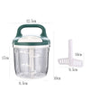KitchenPro Food Chopper in use with chopped vegetables and herbs on wooden countertop.