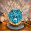 GlowScent Wax Warmer with blue decorative design casting shadows on a wall, perfect for home aroma and ambiance.