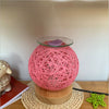 GlowScent Wax Warmer with blue string design creating warm light and ambiance for home decor.