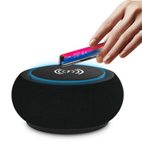 BoomBass Bluetooth Speaker showcasing wireless charging capabilities with a smartphone on top.