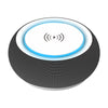 BoomBass Bluetooth Speaker showcasing wireless charging capabilities with a smartphone on top.