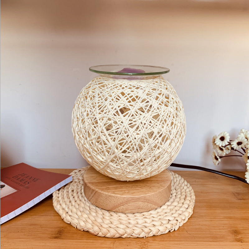 GlowScent Wax Warmer in a decorative woven design with glass top on wooden base for aromatic home ambiance.